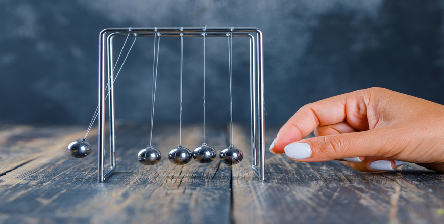 woman-working-newton-s-cradle (1)